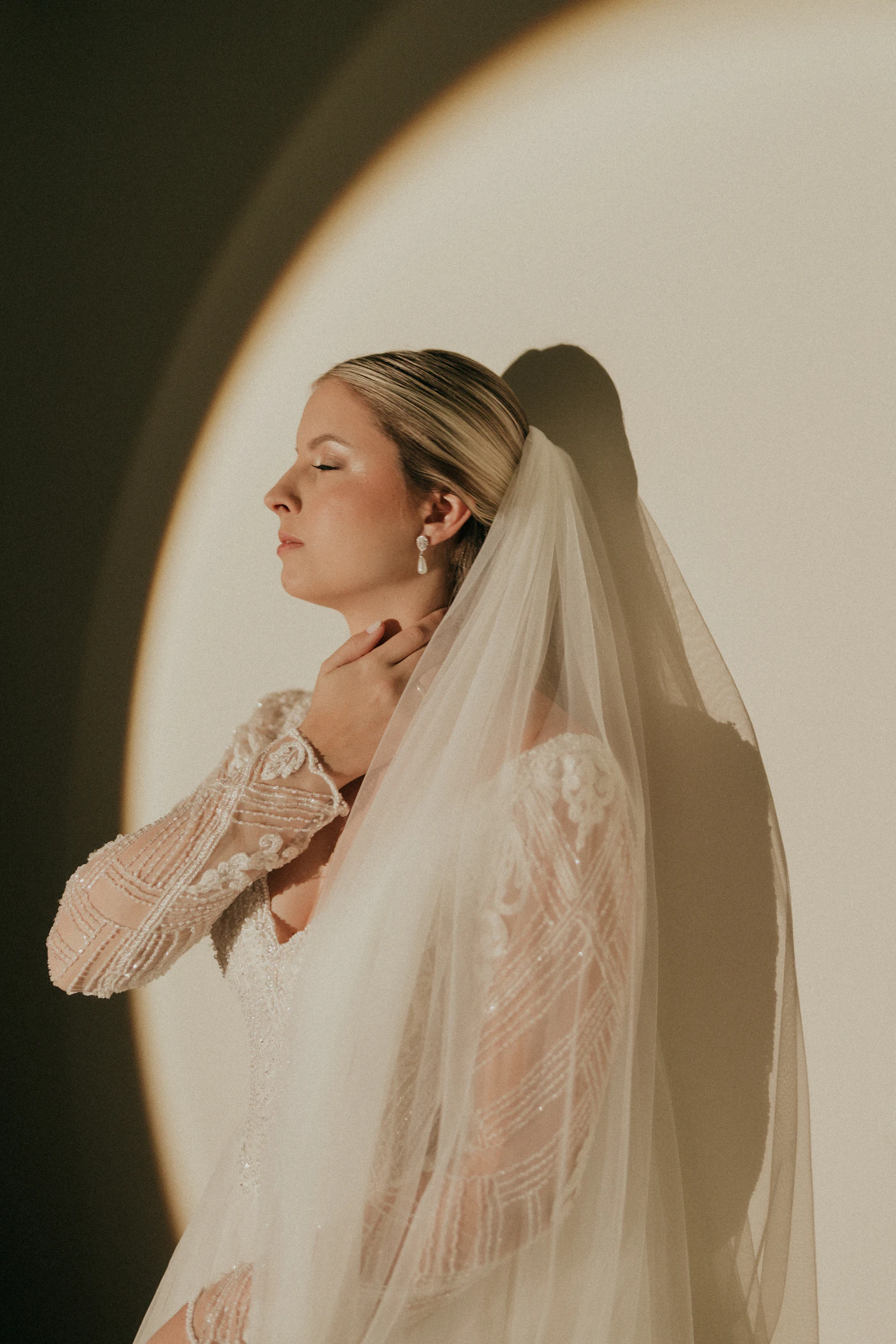 Where to rent luxury wedding dresses for one day — A bride in a rented gown with a cathedral veil.