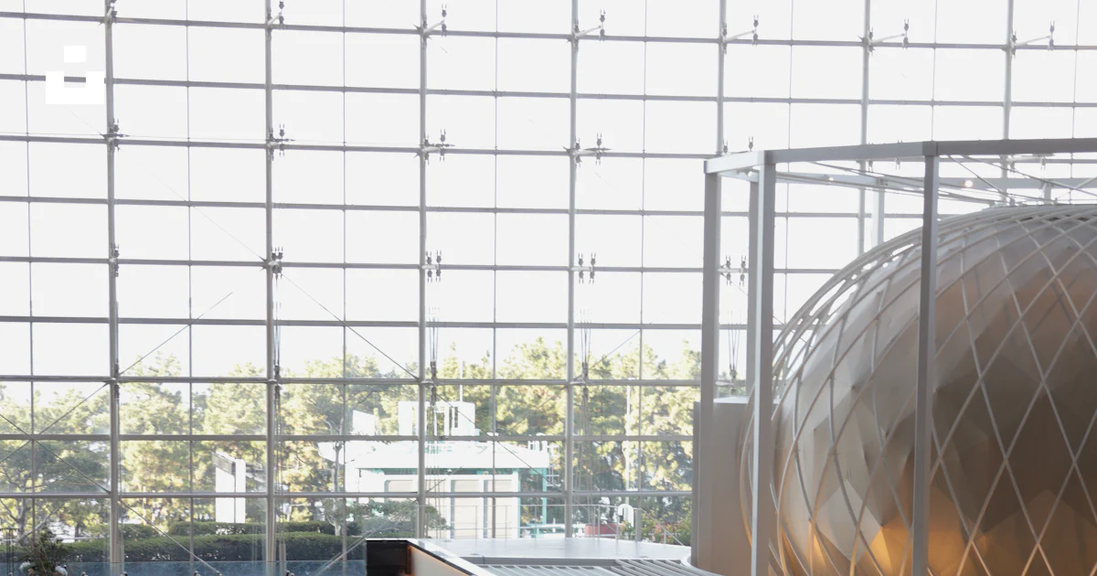 Modern restaurant interior with a vast glass wall and sphere. photo ...