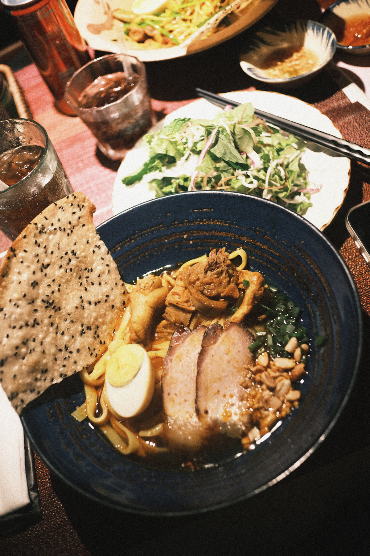Khao soi curry noodle soup with a crispy noodle nest
