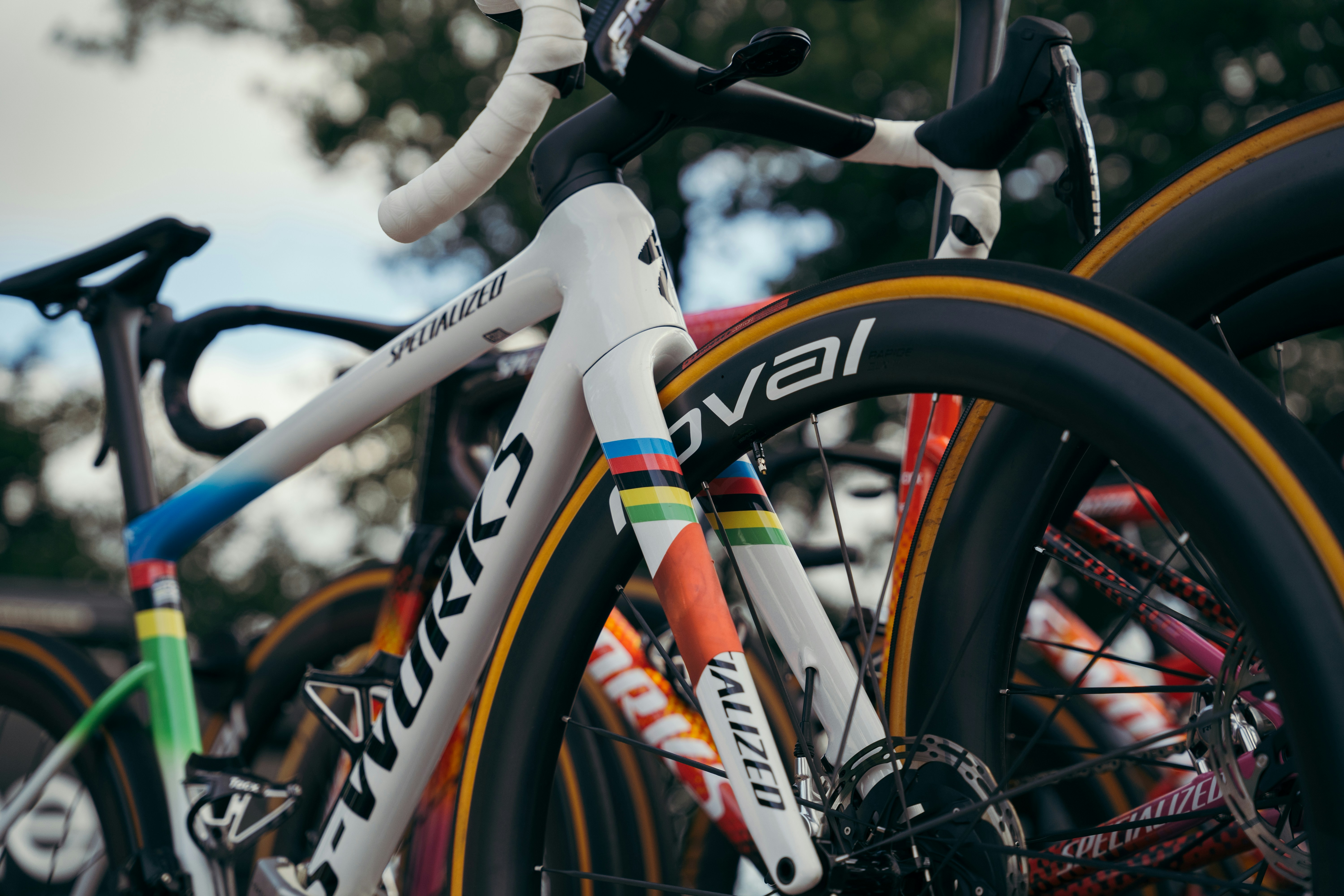 White s-works road bicycle with colorful details and other bikes.