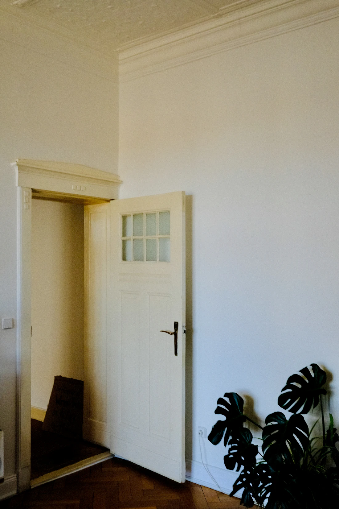 An open doorway with light beyond it, illustrating how an unsecured exit allows nursing home elopement