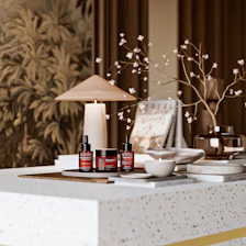 Skincare products and elegant decor on a modern white counter.