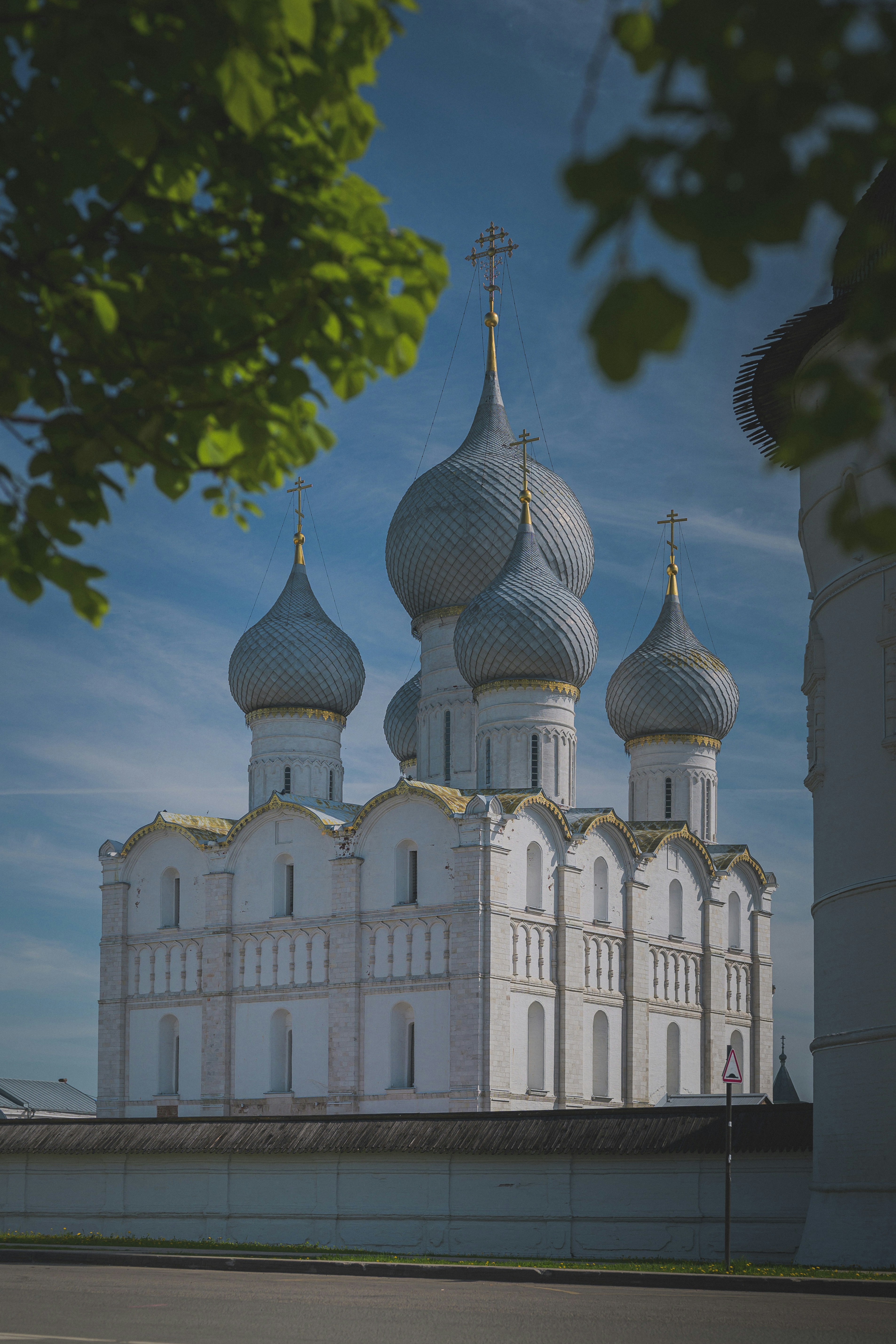 White church with silver domes under blue sky