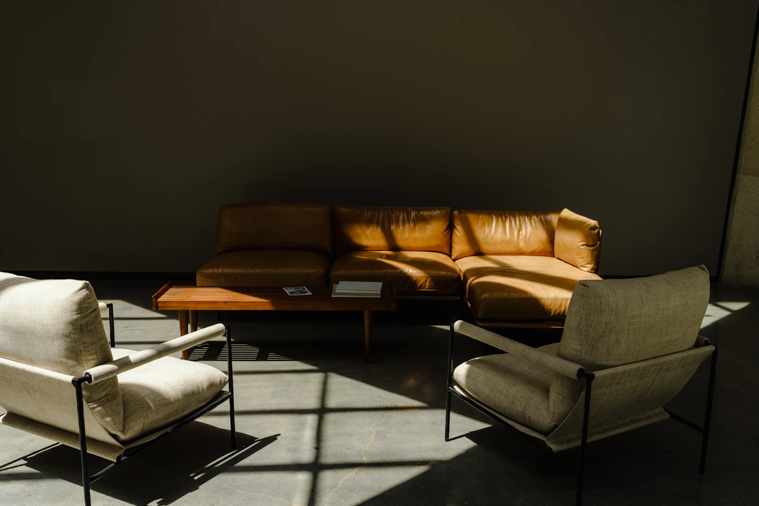 Modern living room with leather seating and natural light