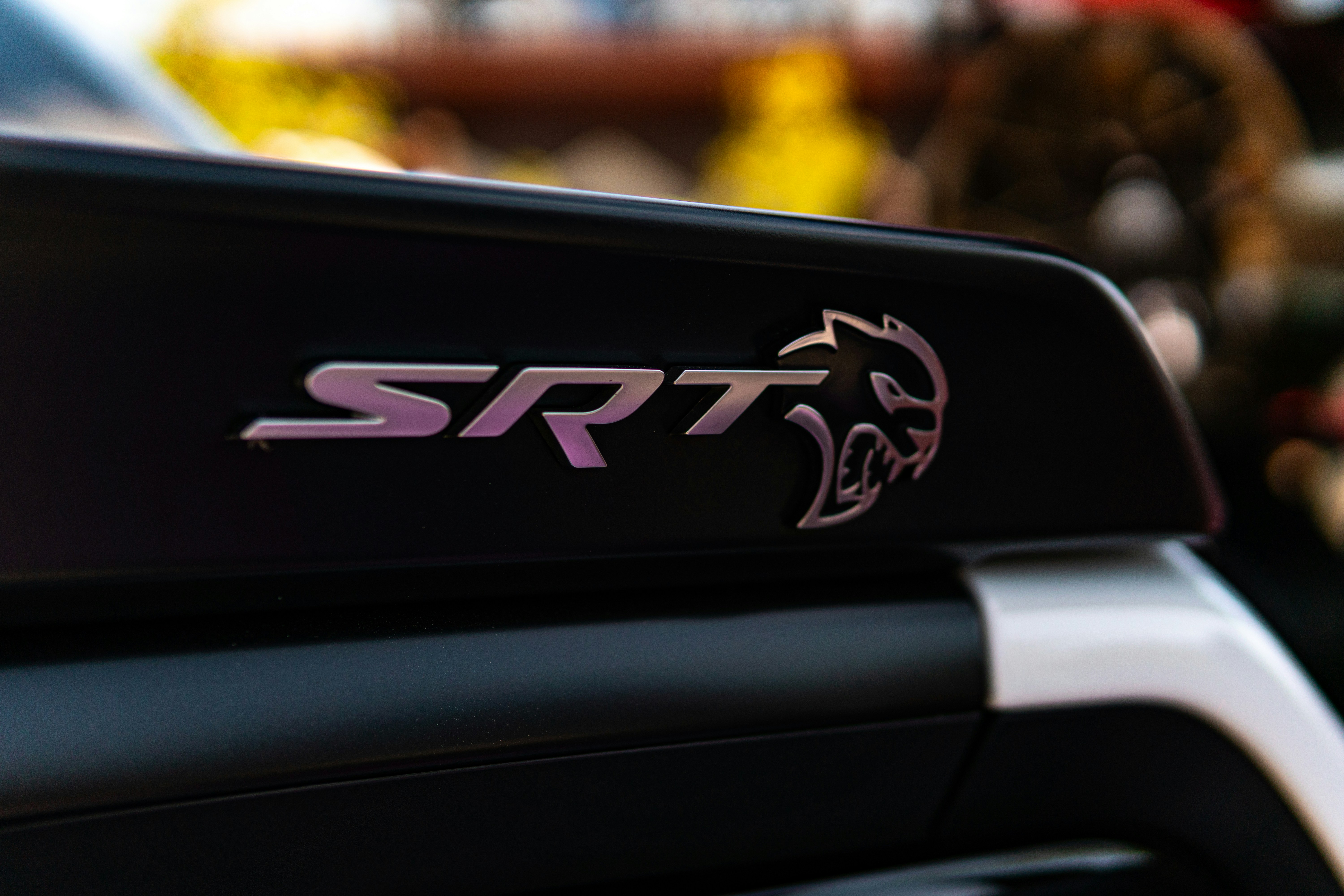Close-up of srt hellcat car emblem on spoiler