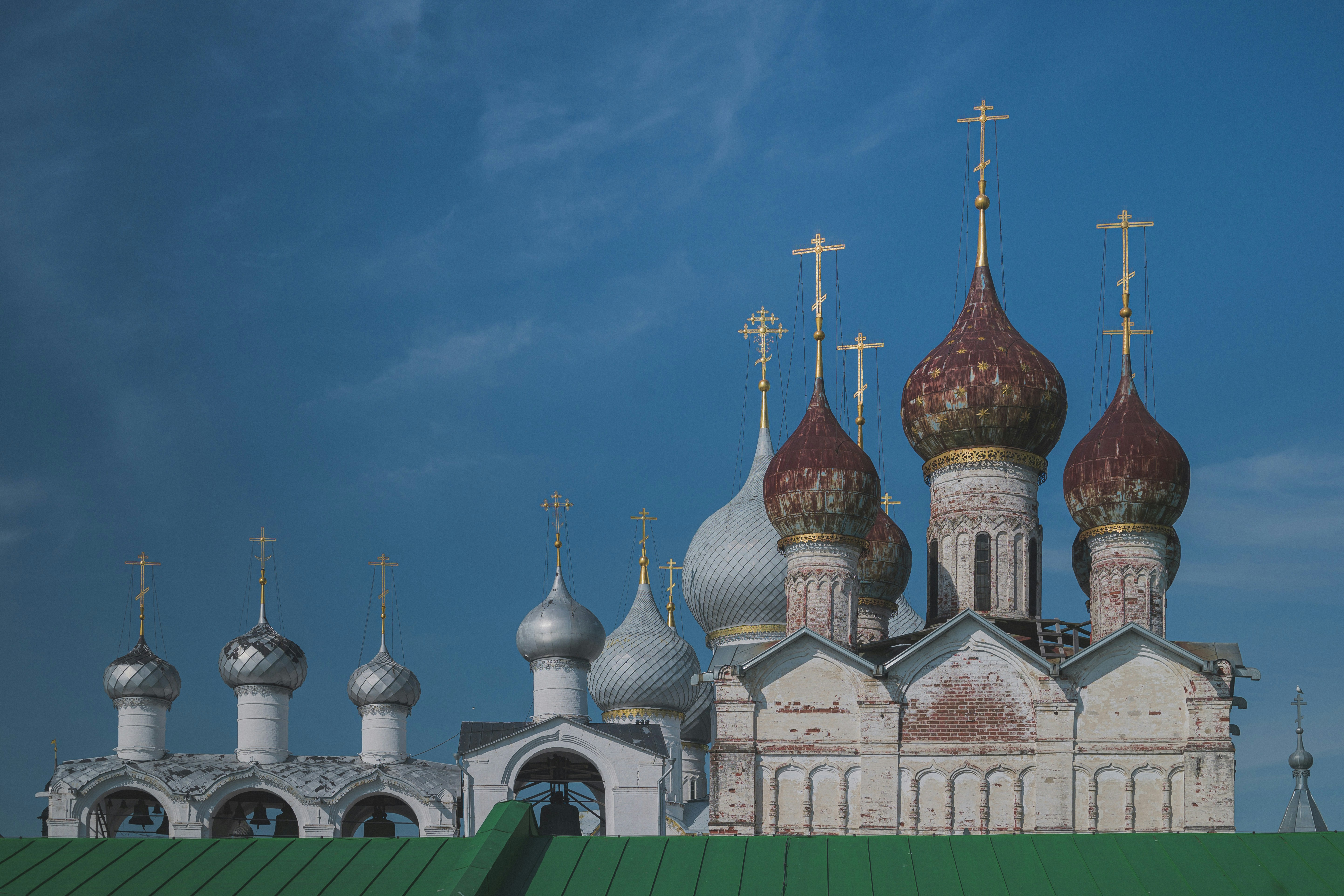 Orthodox church domes against a bright blue sky