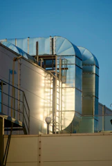Industrial ventilation ducts on a building rooftop.