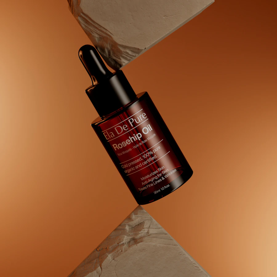Amber facial oil bottle balanced in warm studio light