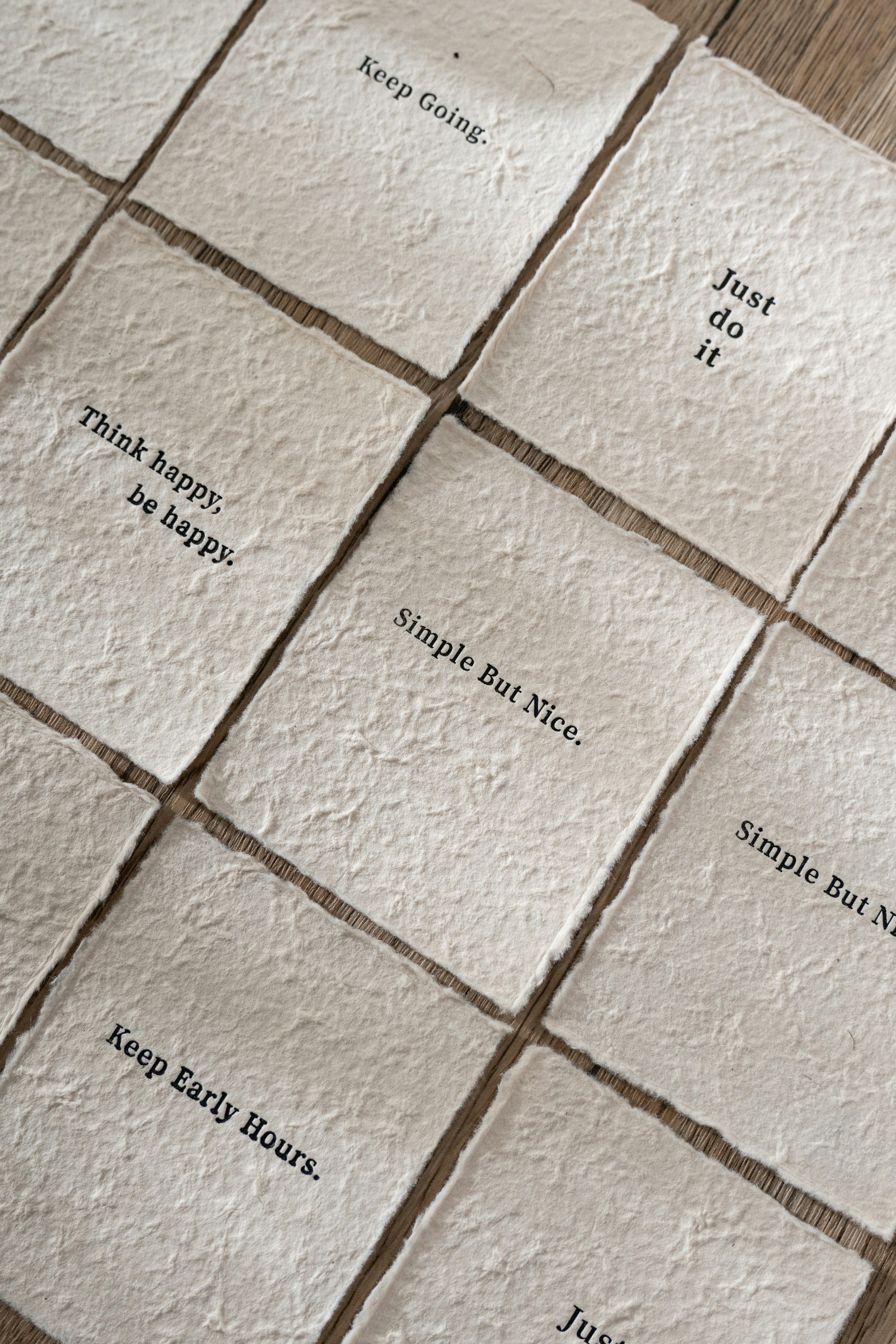 Motivational quotes on textured paper squares