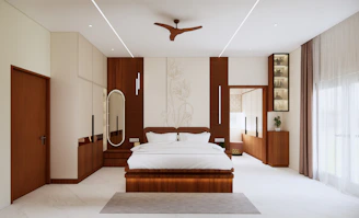 A modern bedroom with a large bed and wooden furniture