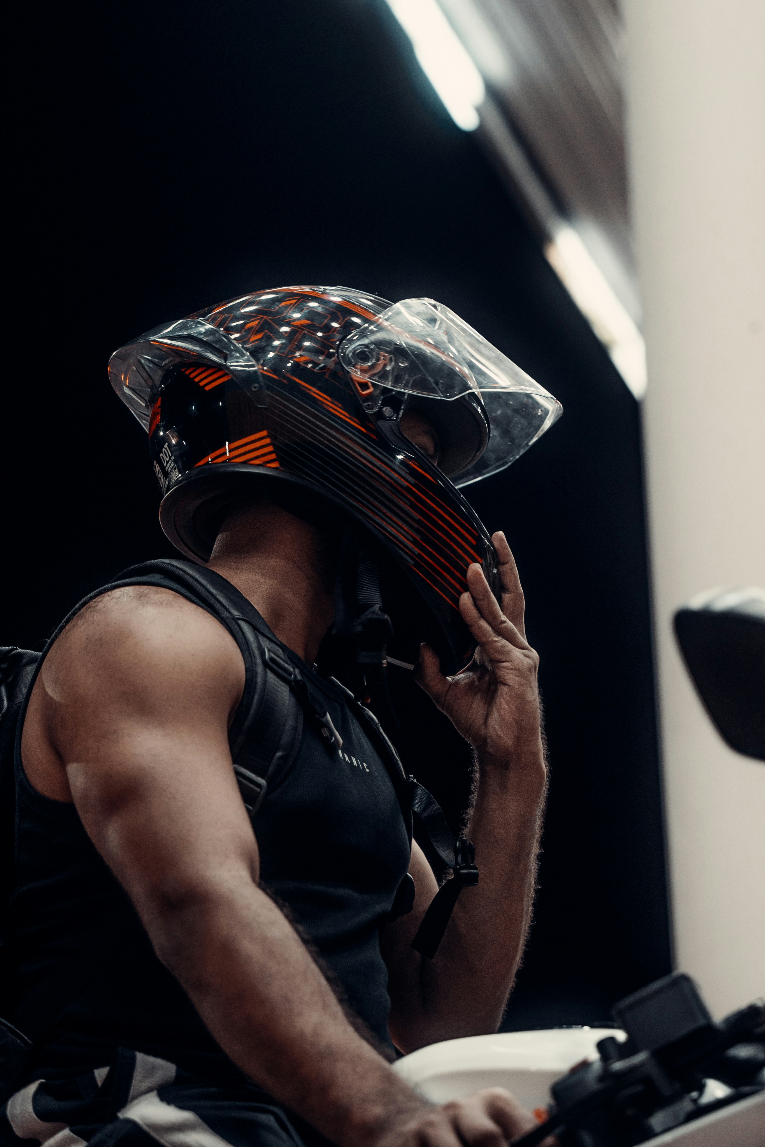 Motorcycle rider adjusting a helmet before riding