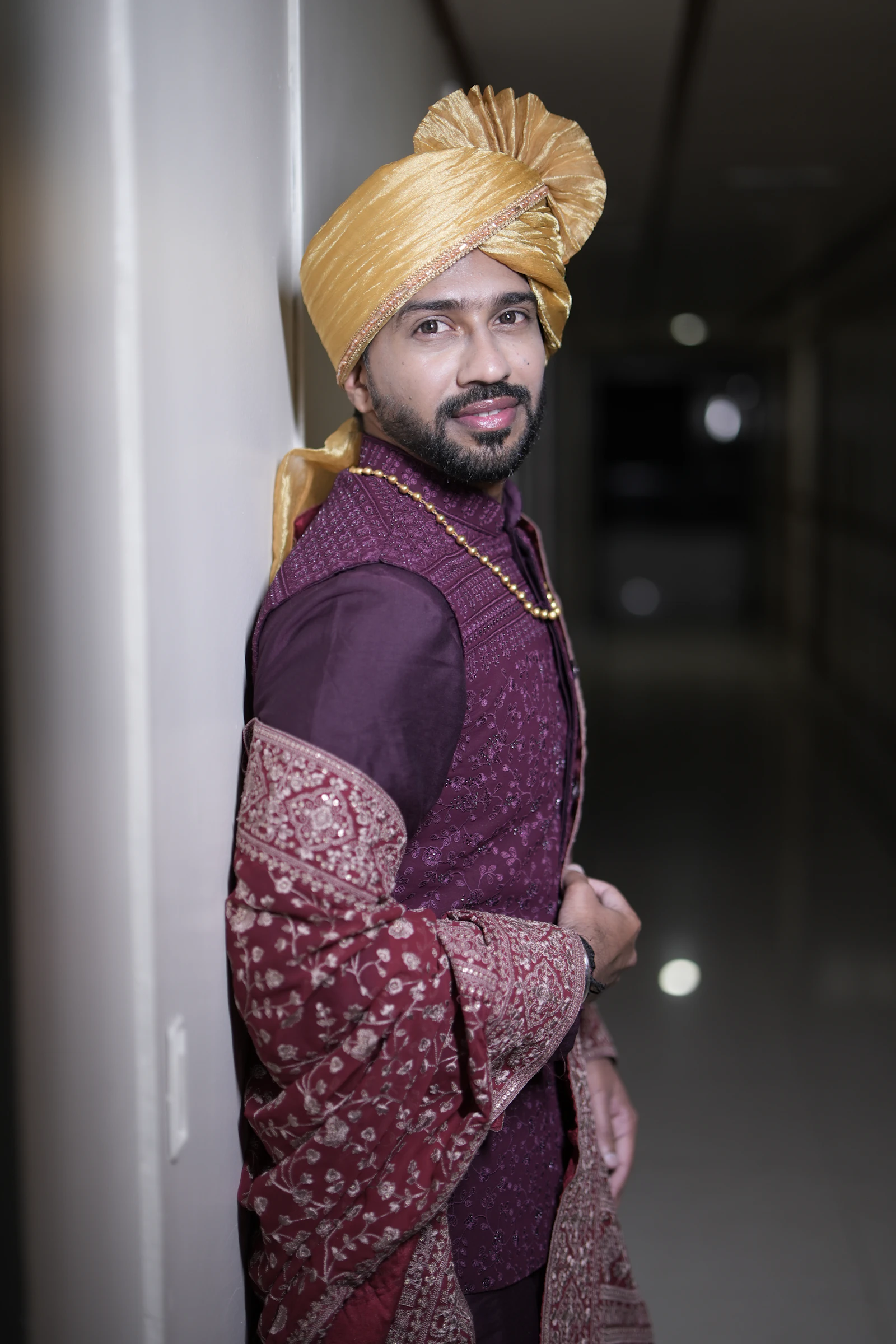 Man in a golden turban and traditional kurta set