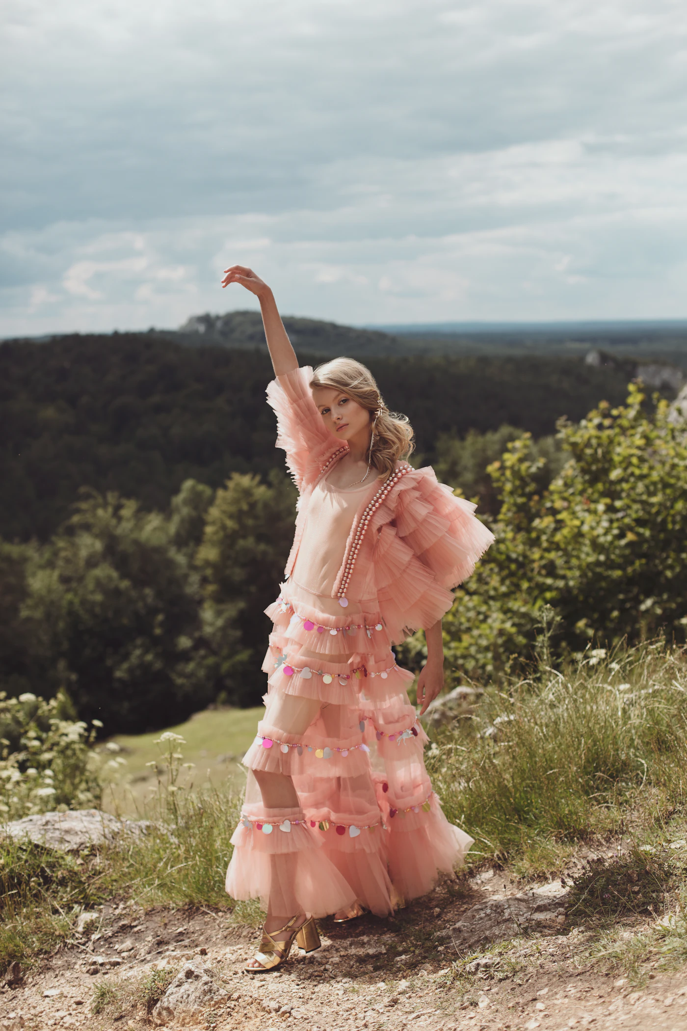 Pink tulle dress on a hillside