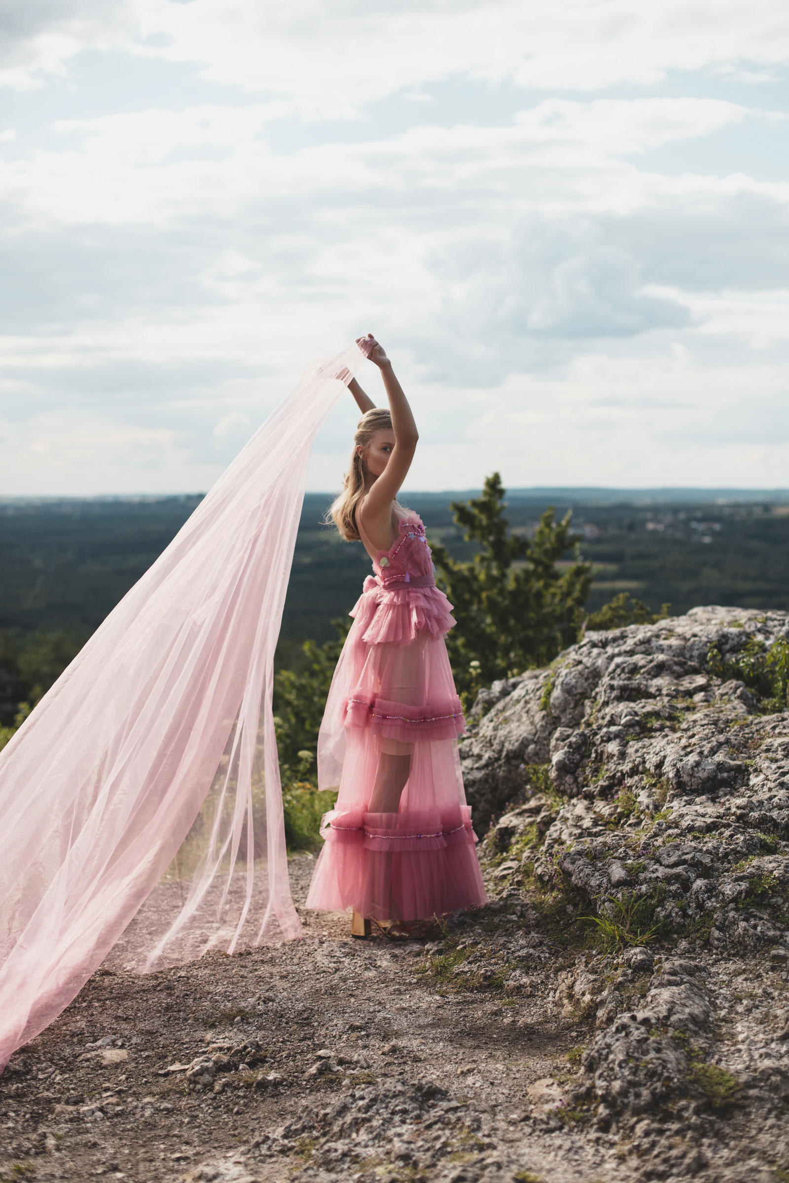 A woman in a dramatic chiffon gown