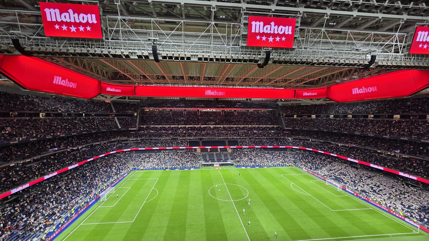 A football pitch inside a stadium