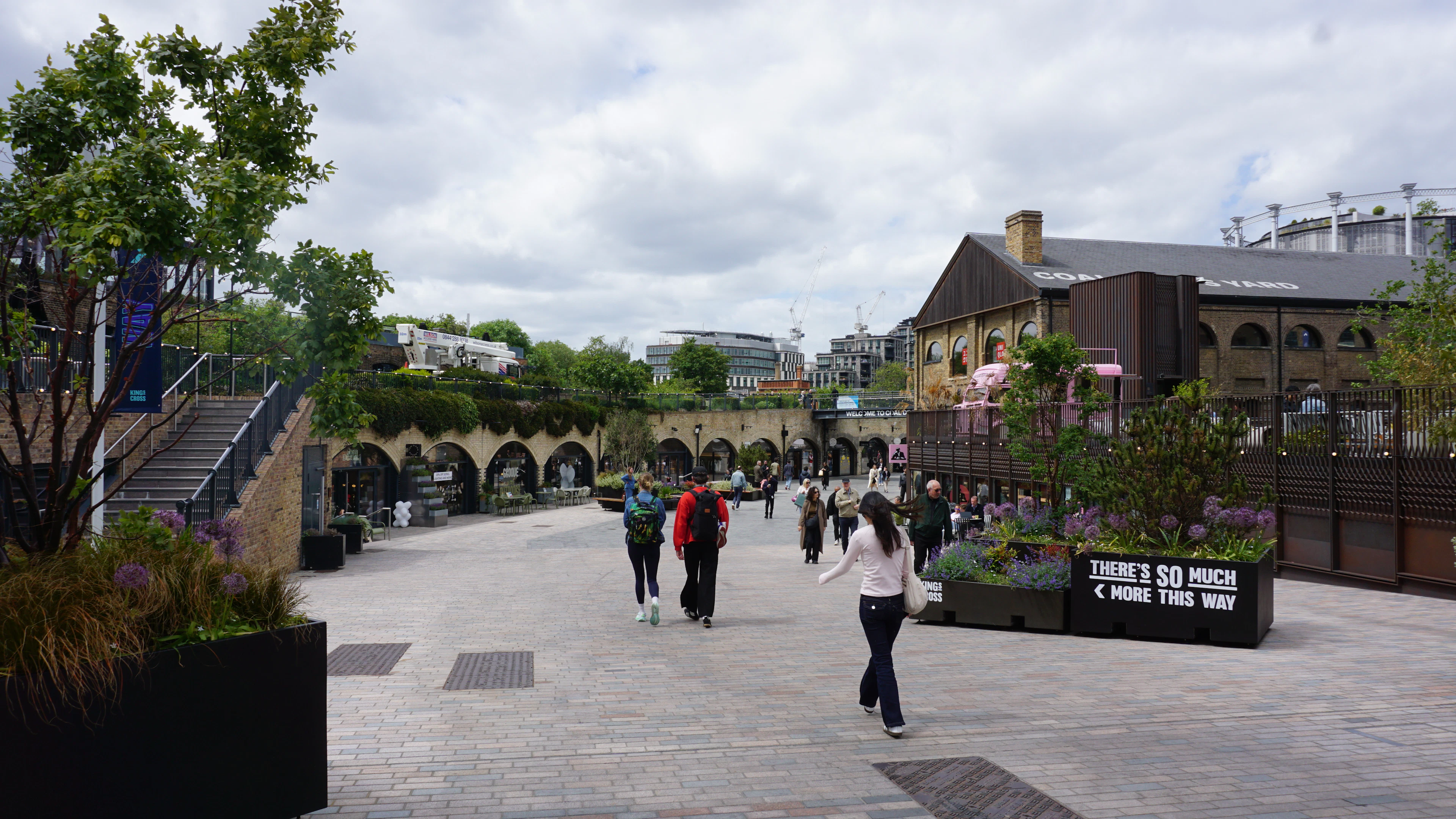 People walking through Coal Drops Yard in King's Cross