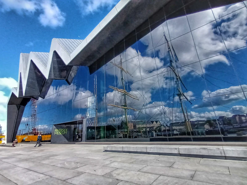 Riverside Museum Glasgow reflecting the Tall Ship and cloudy sky