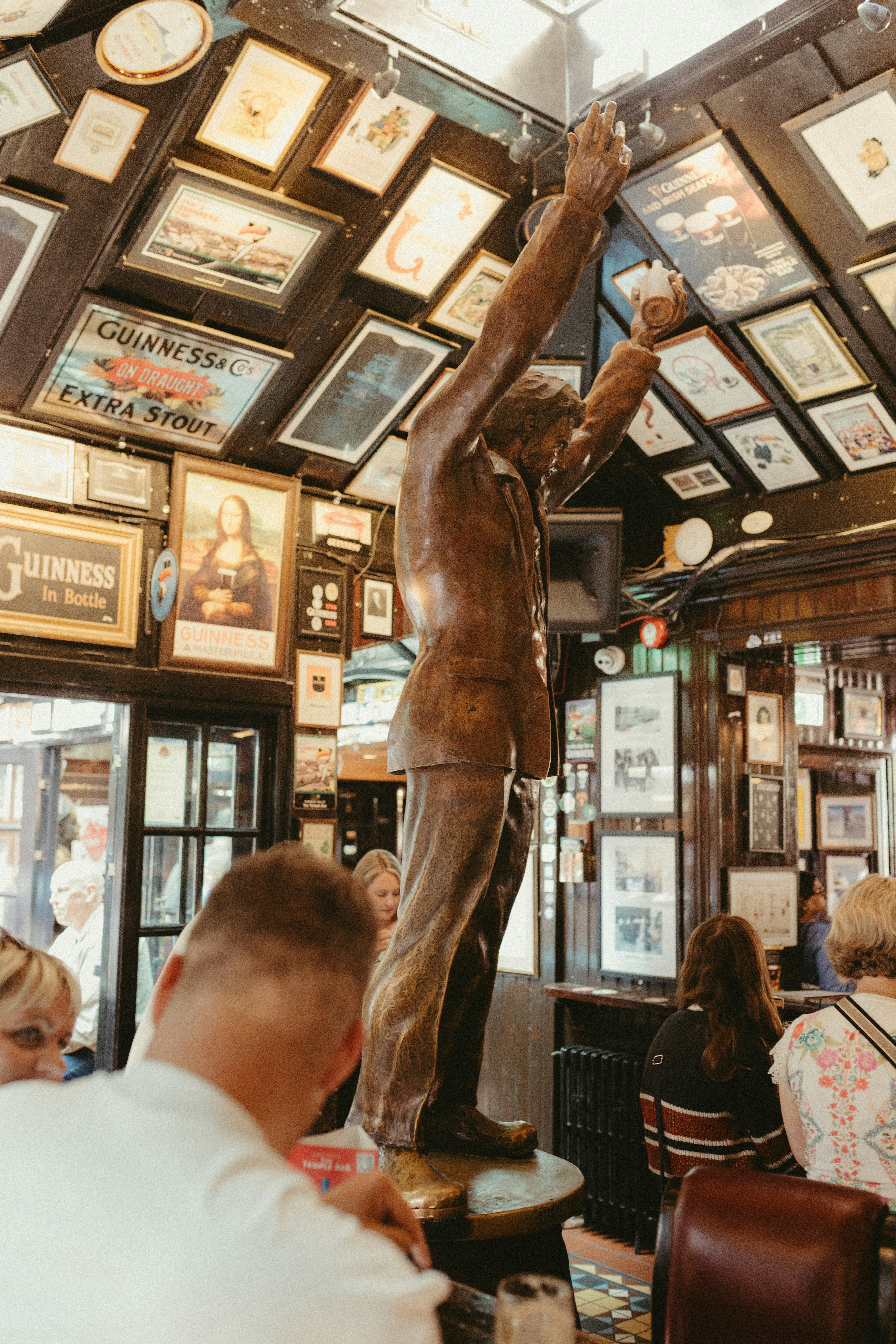Traditional Irish pub interior filled with vintage photographs and memorabilia