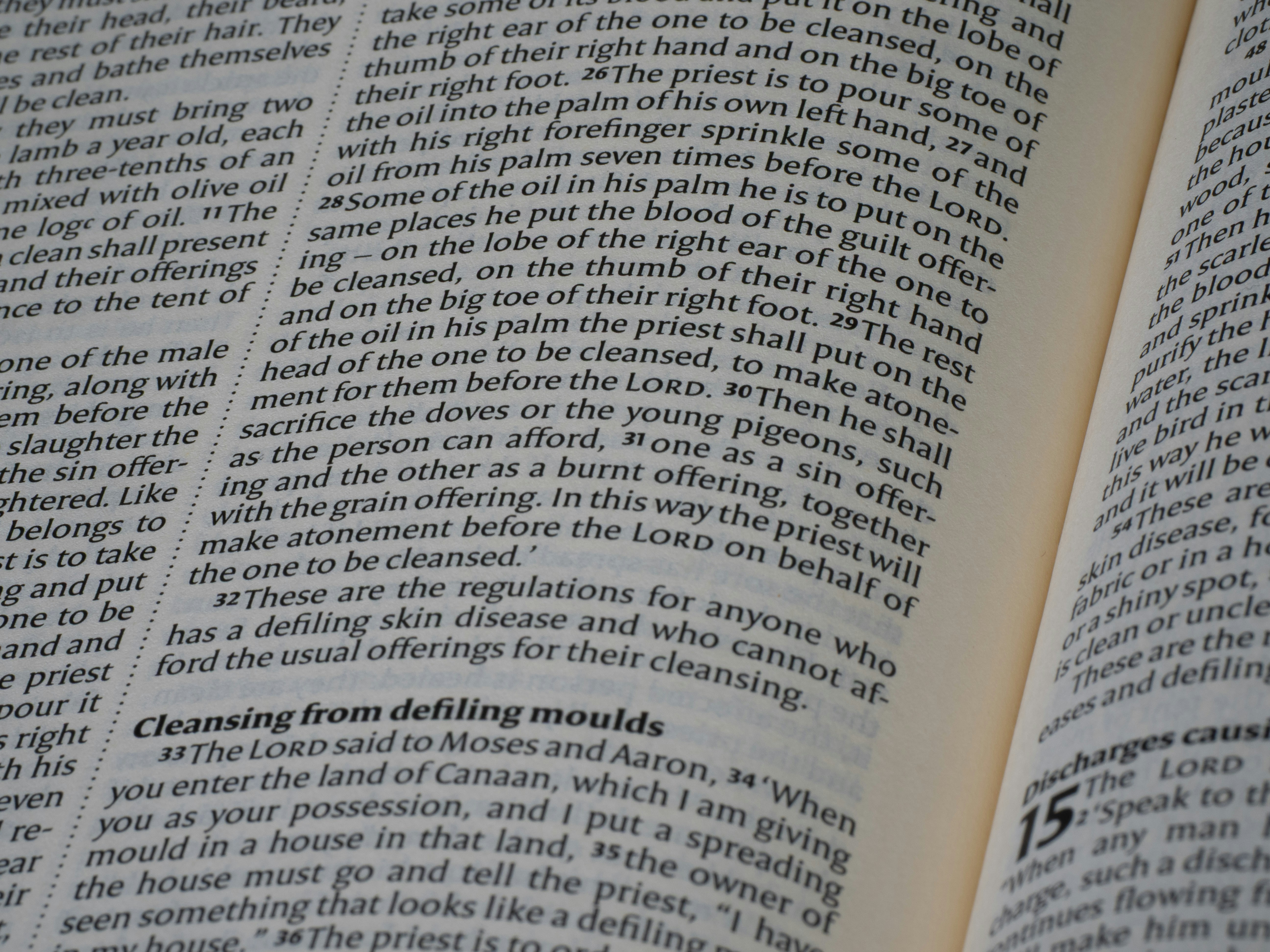 Open book displaying dense lines of printed text.