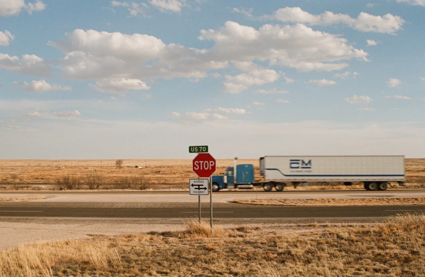 American semi truck on a US highway, Bricz keeps Manhattan TMS deployments running across live carrier networks
