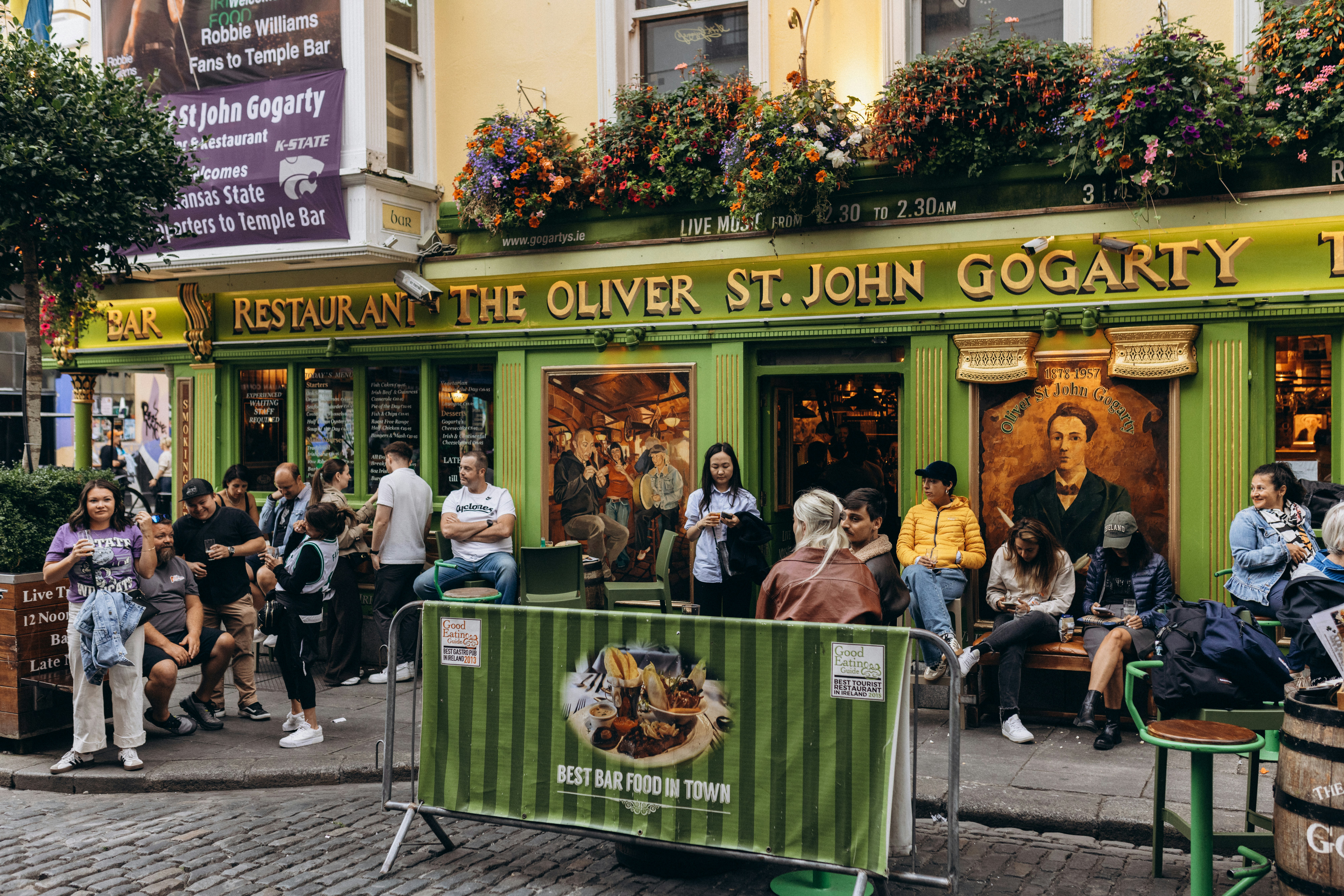 People gather outside the oliver st. john gogarty pub.