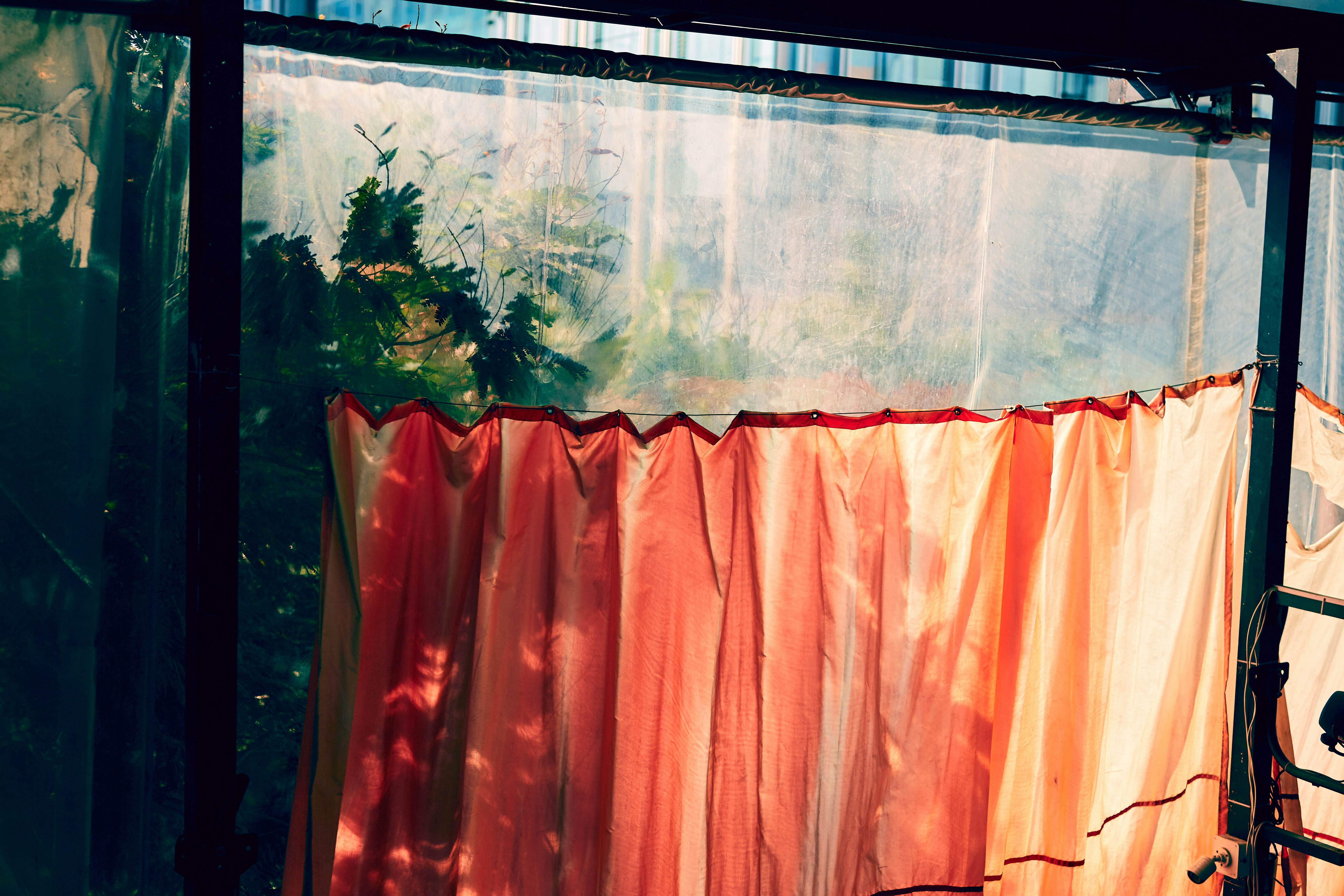 fade-resistant patio drapes being measured beside a luxury pool area