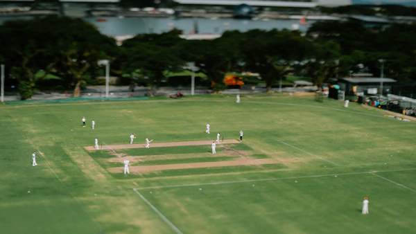 Cricket match in progress on campus field