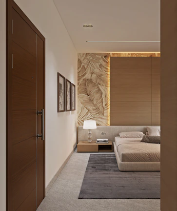 Contemporary bedroom with a bed, nightstand, lamp, and textured wall.