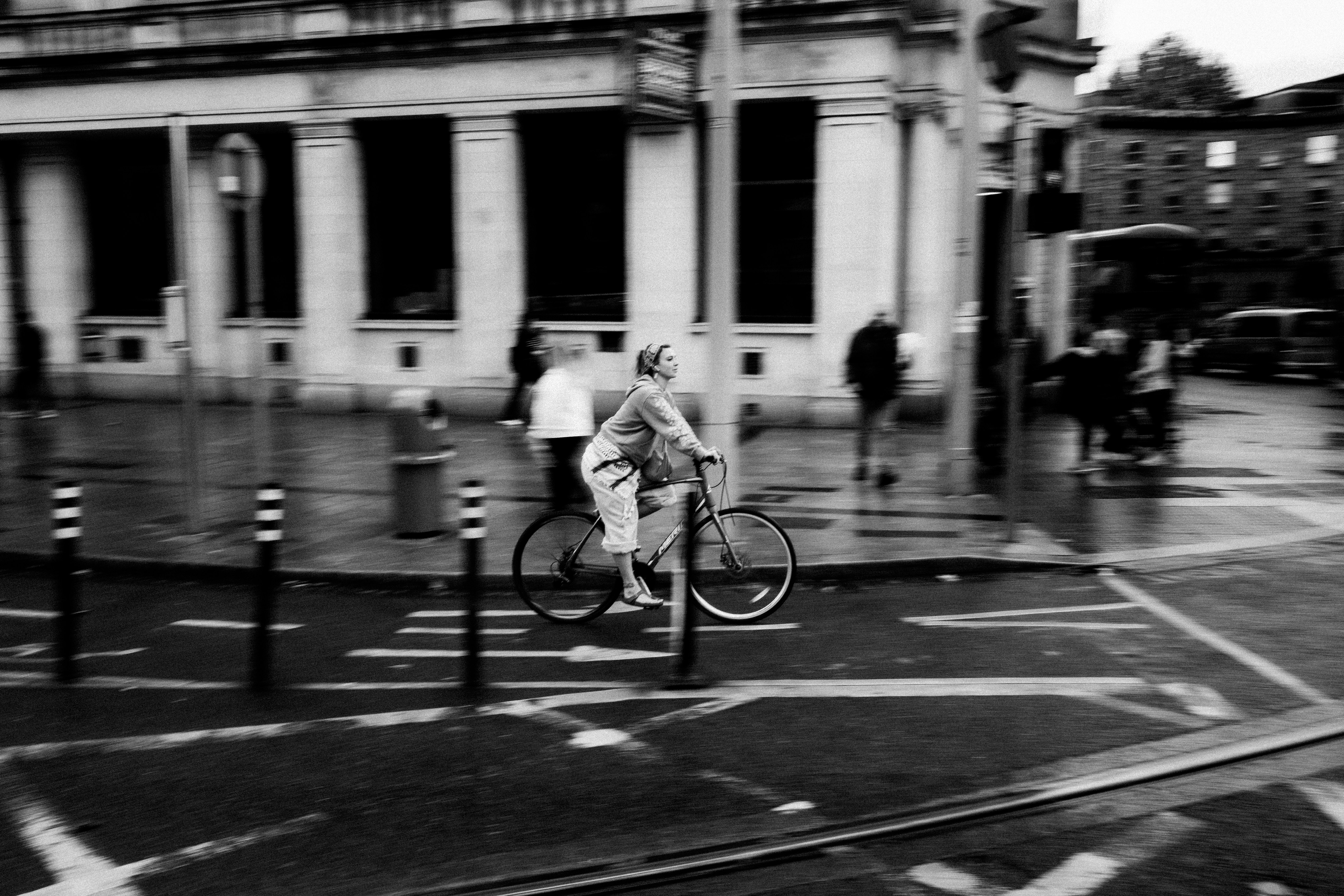 Cyclist riding through a rainy city street