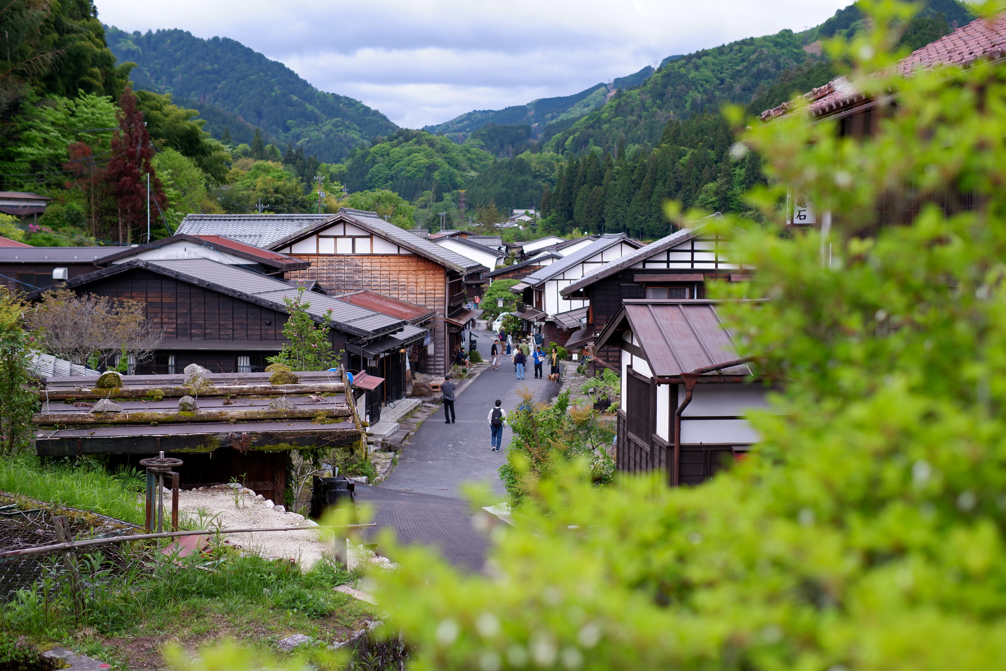 Wooden post-town houses in Tsumago, set in the green Kiso Valley