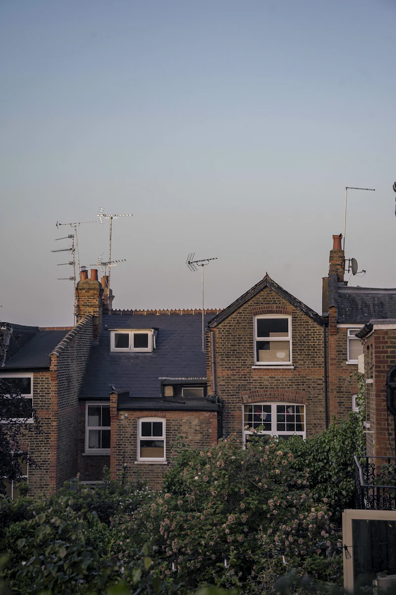 Brick terraced houses with rooftops and aerials