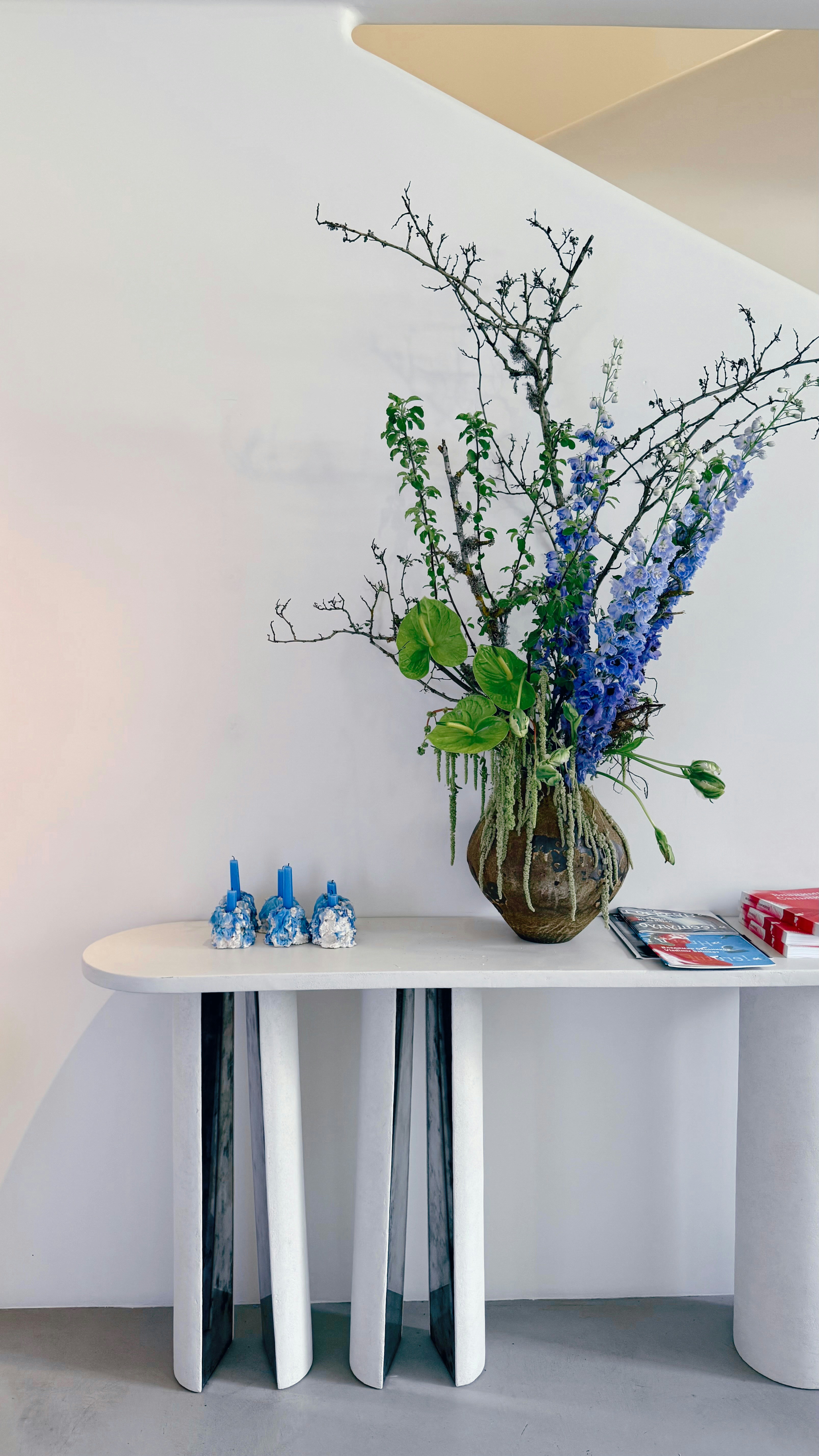 Console table with ceramics and cut flowers