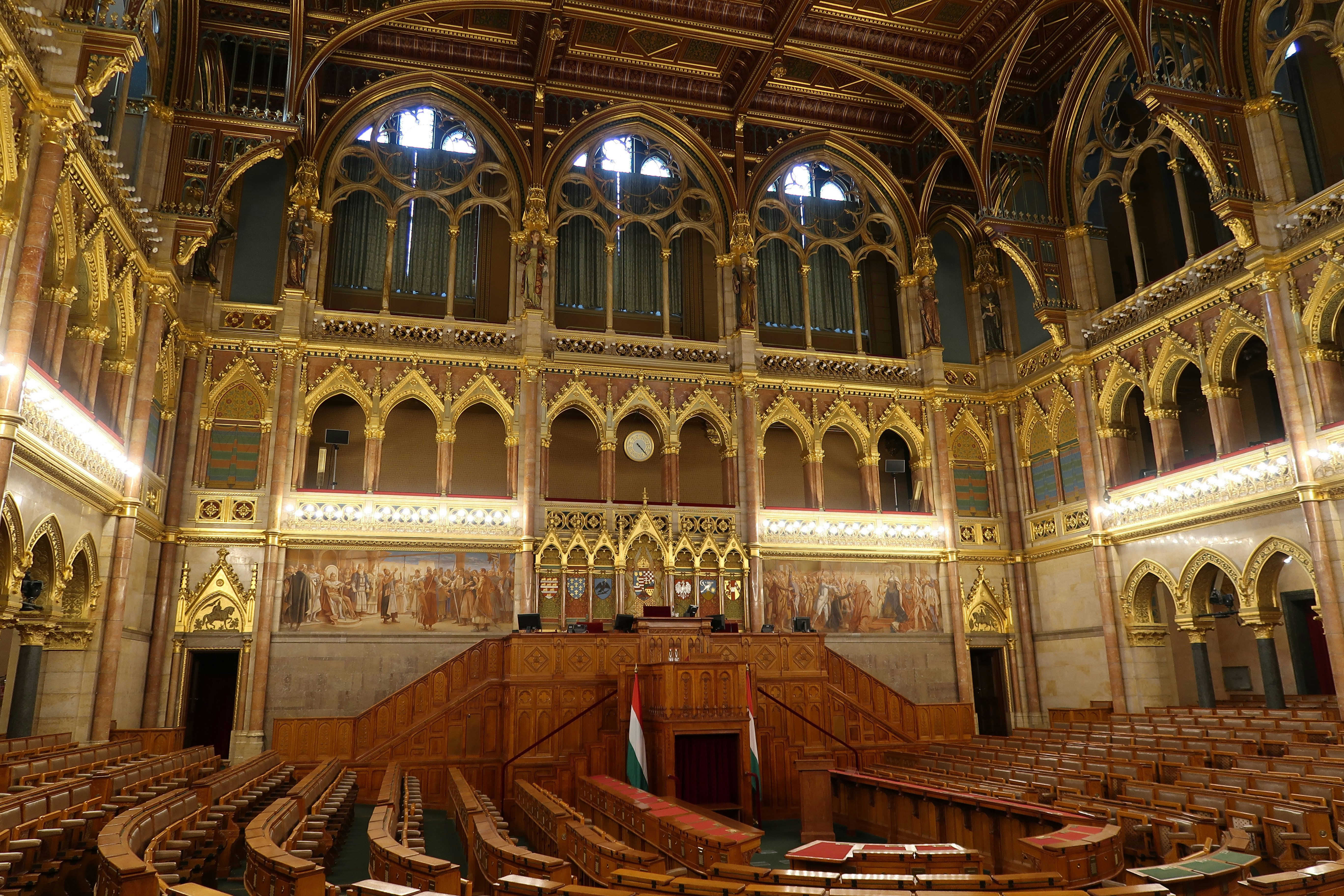 Hungarian parliament interior with ornate gold and wood decorations.