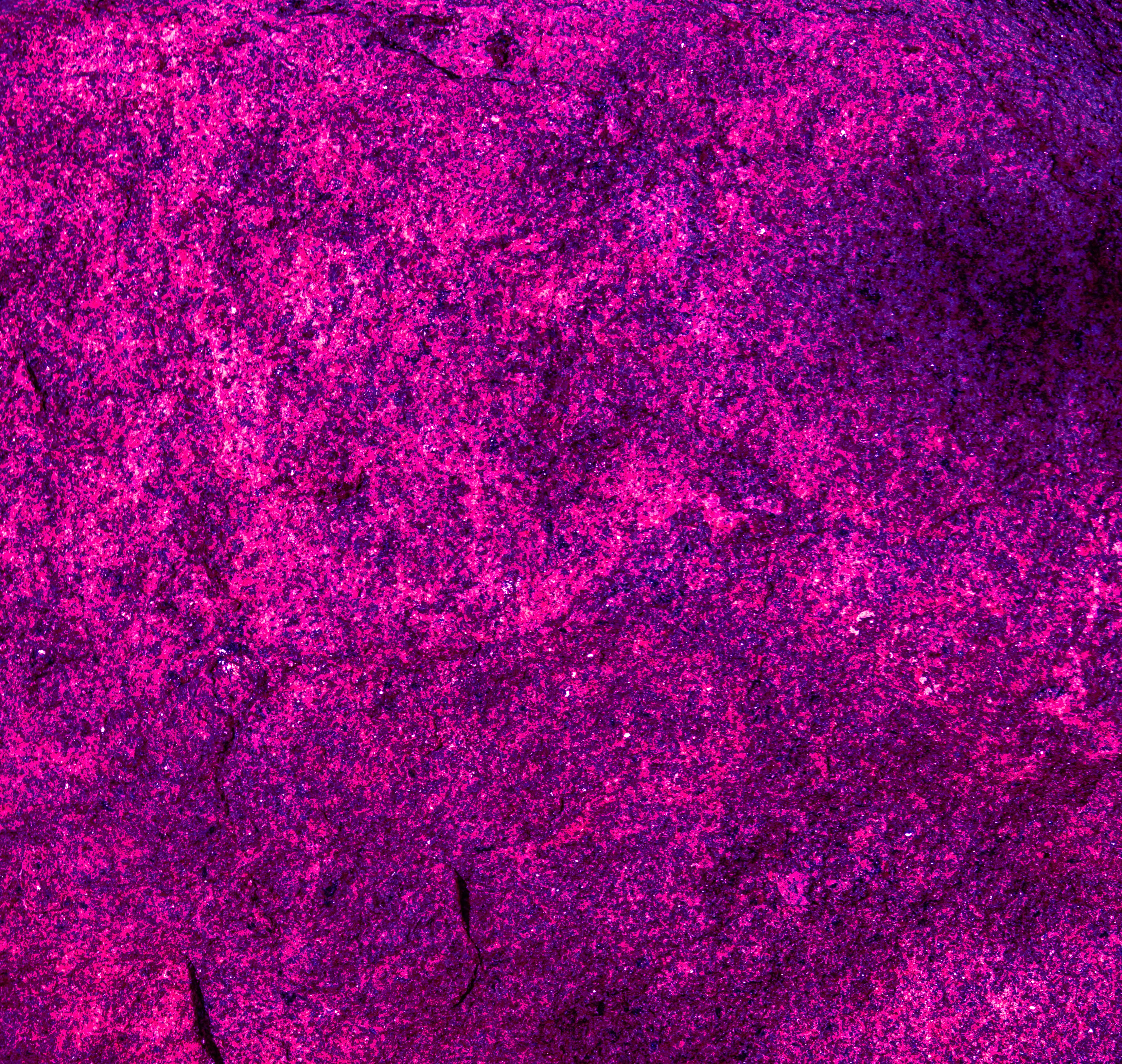 A vibrant magenta and purple textured surface.
