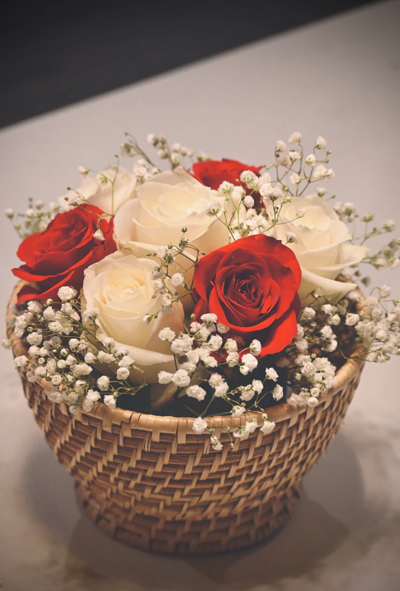Woven basket filled with red and white roses
