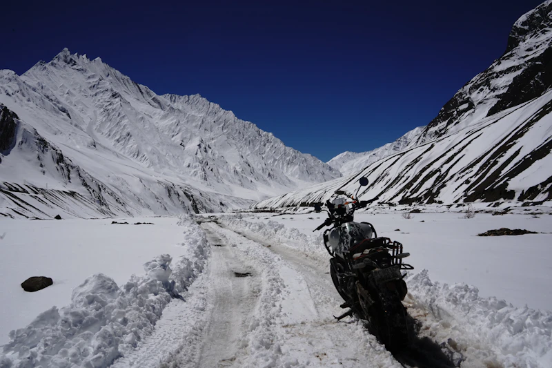 Motorcycle on a snowy mountain road