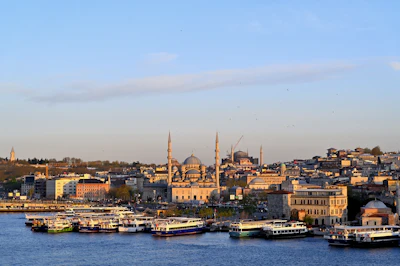 The New Mosque and Hagia Sophia above the Golden Horn ferry piers at sunset