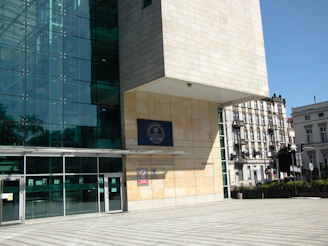 Modern building with glass facade and stone sections