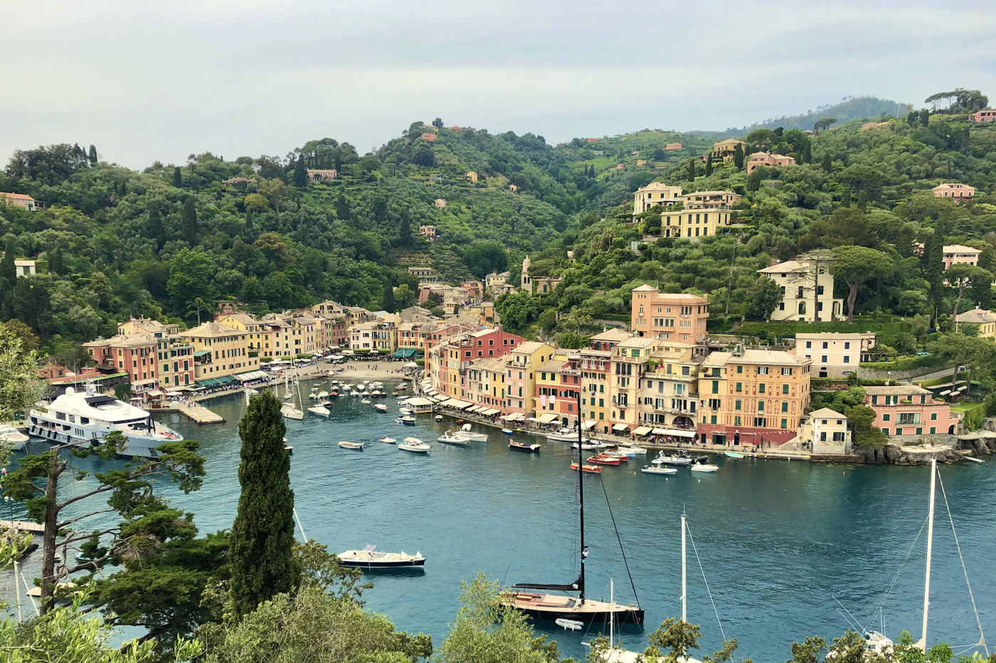 The harbor of Portofino on the Italian Riviera, with colorful houses and boats in the bay