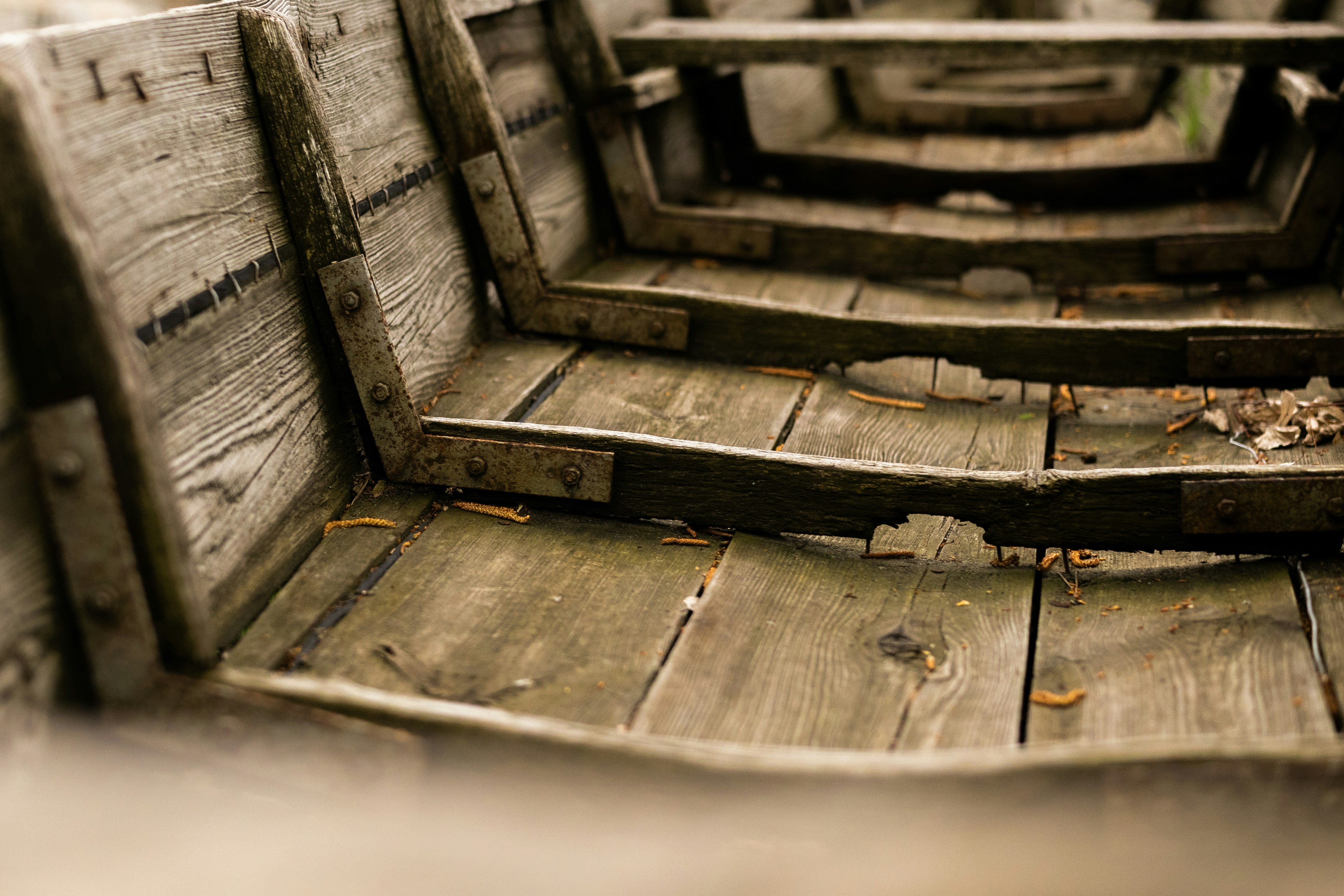 Interior view of an old, weathered wooden boat.