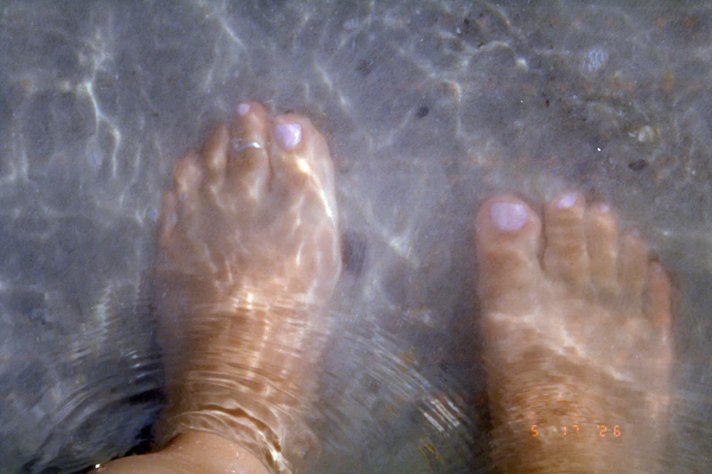 Feet soaking in a warm pedicure bath