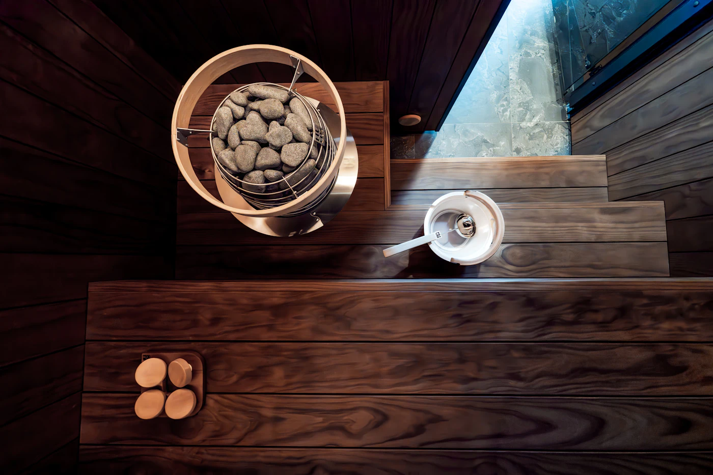 Modern wooden sauna interior with heater and benches