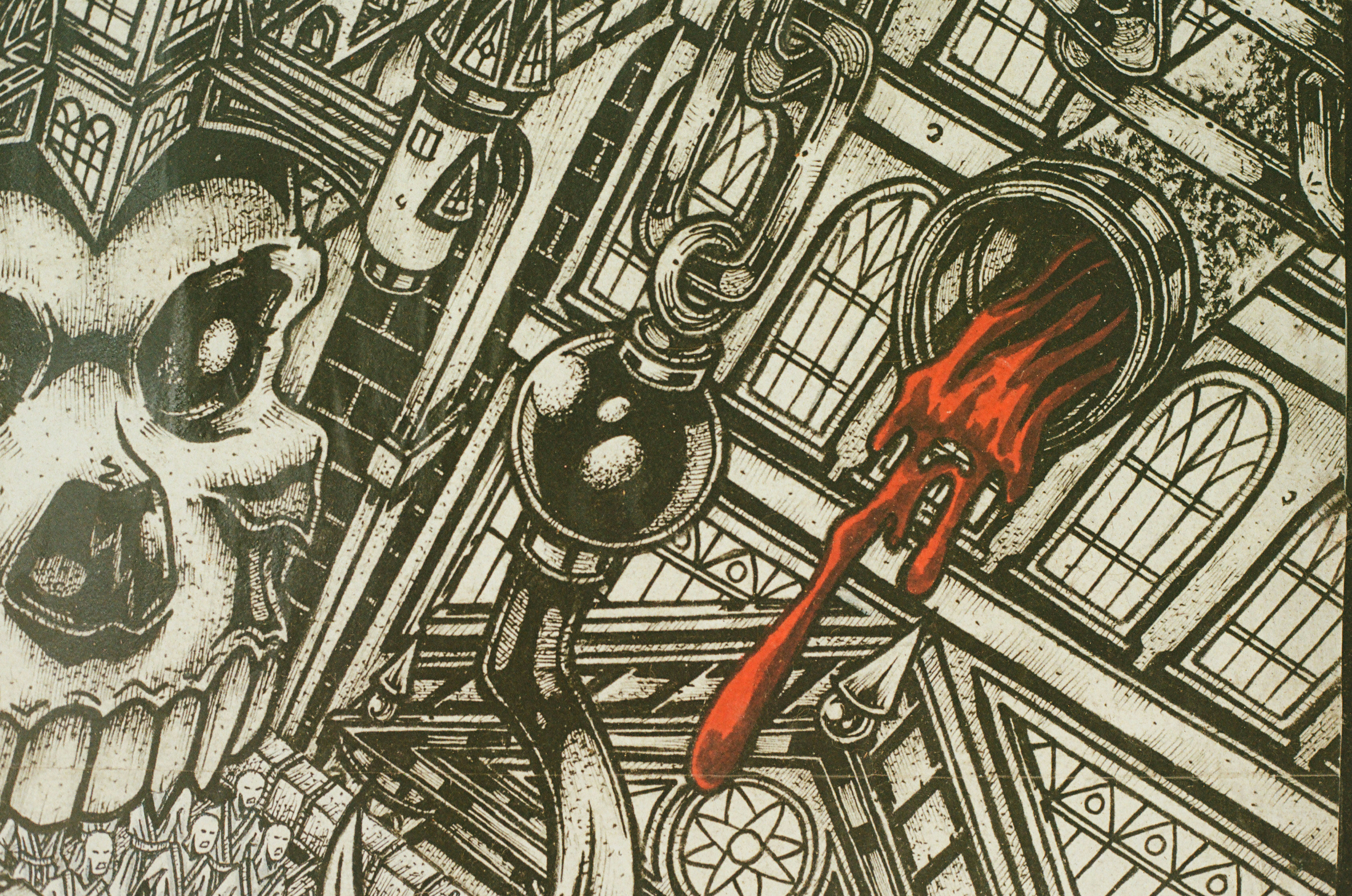 Detailed gothic drawing with skull, chains, and red liquid.