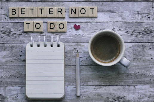 Scrabble message "better not to do" with coffee and stationery