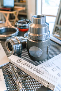 Schuck group ruler with metal parts and technical drawings.