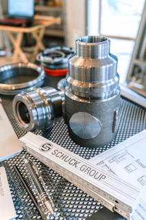 Schuck group ruler with metal parts and technical drawings.