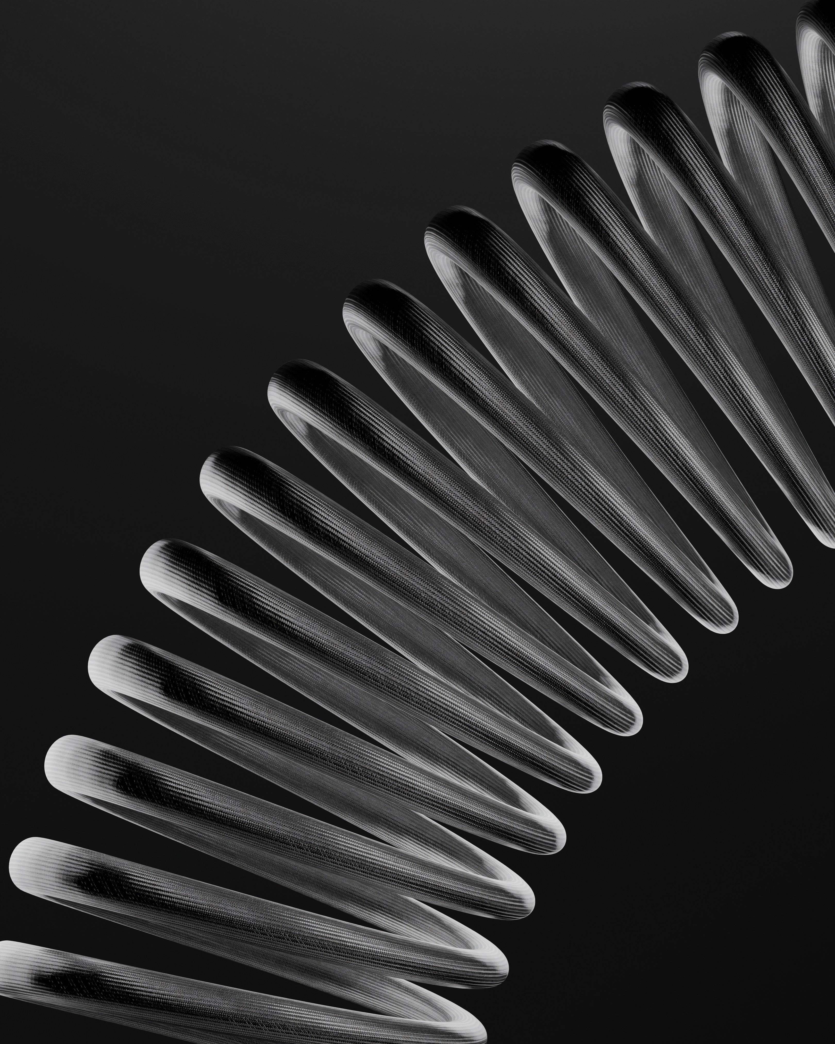 Transparent coiled spring structure on a dark background.