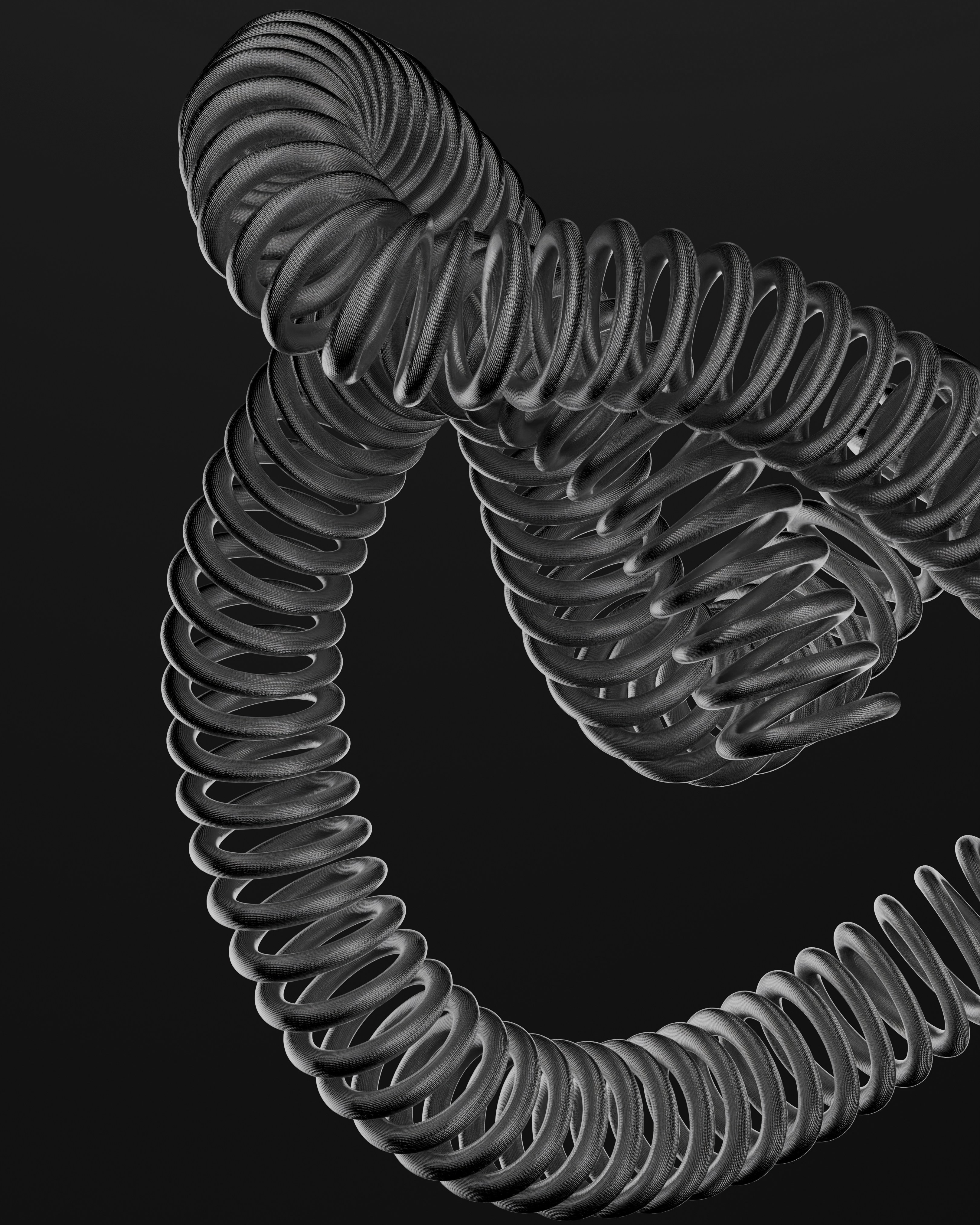 Dark, coiled metallic abstract shape on black background.