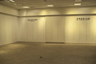 Empty room with 'selected' and 'premium' text on walls
