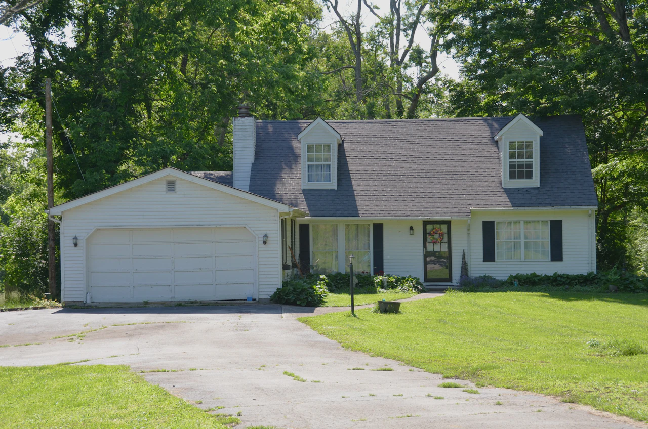 White farmhouse exterior representing Hiram GA real estate and Hiram home value planning